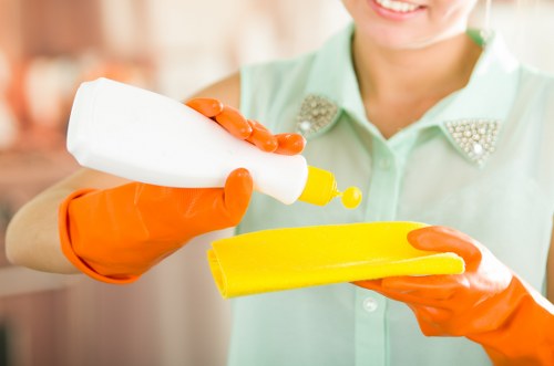 Local carpet cleaner treating a hallway carpet in W3